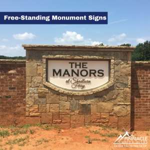 Free-standing monument sign for The Manors subdivision.