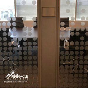 Vinyl graphics for a glass walled meeting room adds a branded feel to the room.