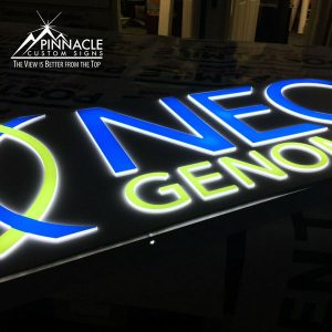 Lighted lobby sign for NEO Genomics. The design was laser cut.